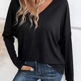 Black V-neck long sleeve blouse for women, paired with jeans, highlighting casual and lightweight design.