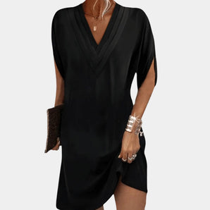 Black V-neck short sleeve elegant lightweight summer dress showcasing a tailored fit with a defined waist and a smooth one-piece design.