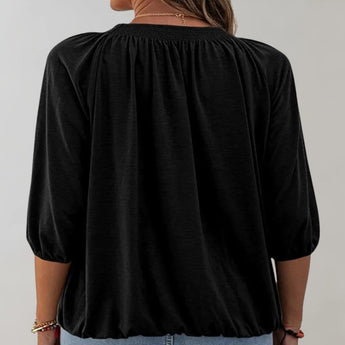 Black velvet blouse with a gathered neckline and casual loose fit, featuring long sleeves and a stylish design suitable for a fashionable look.