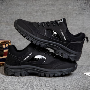 Black waterproof hiking shoes designed for durability and non-slip traction, featuring a sporty and athletic style suitable for outdoor trails.
