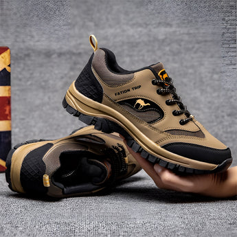 Black waterproof hiking shoes designed for durability and non-slip performance, suitable for outdoor trails and walking, featuring a grey color with a sporty style.