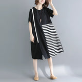 Black and white asymmetric stripe summer midi dress with a loose fit, featuring a collar and medium-length sleeves, designed as a one-piece garment.