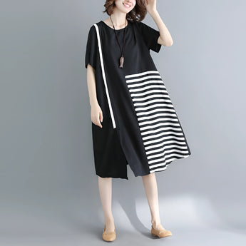 Black and white asymmetric stripe summer midi dress with a loose fit, featuring a collar and medium-length sleeves, designed as a one-piece garment.