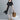 
A black and white asymmetric stripe summer midi dress with a loose fit, featuring a round neck, short sleeves, and a knee-length hem.