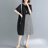 
A black and white asymmetric stripe summer midi dress with a loose fit, featuring a knee-length design, short sleeves, and a round neckline. The dress is displayed in size 3XL, showcasing its comfortable and stylish design suitable for daytime wear.