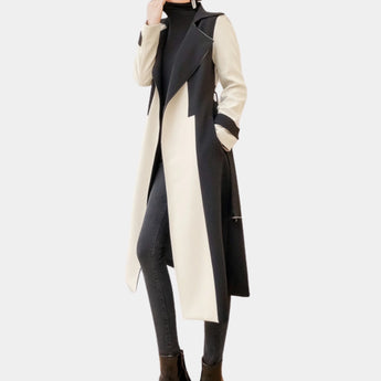 Black and white belted trench coat with a monochrome design, featuring a classic collar and waist tie, modeled by a person wearing sunglasses, a dress shirt, and a tie.