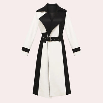A black and white belted trench coat featuring a stylish collar and long sleeves. The coat has a chic, monochrome design suitable for formal events, demonstrating a classic and elegant outerwear style.