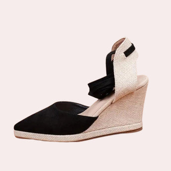 Black and white lace-up open toe espadrilles featuring a wedge heel, made with a combination of beige composite materials and leather, designed as women's summer sandals.