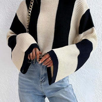 Black and white striped bell sleeve knit sweater featuring a trendy autumn fashion design with distinct sleeve and shoulder details.