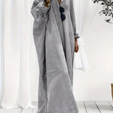 
A plus-size black and white striped maxi dress with long sleeves, designed for breezy beachwear. The dress features a flowing silhouette, a comfortable fit, and is suitable for 3XL size.