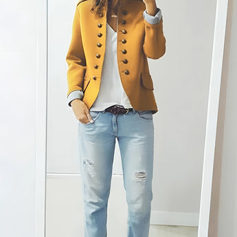 A plus-size yellow double-breasted military jacket with silver buttons, featuring a stylish autumn design, modeled by a woman.