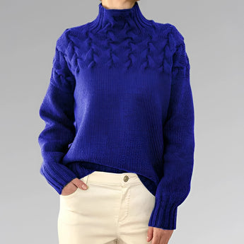 Women's royal blue turtleneck sweater in a cable knit design, suitable for fall fashion. The sweater is woolen, featuring long sleeves and a cozy fit for a 2XL size.