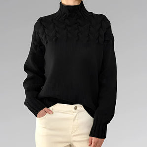 Black wool cable knit turtleneck sweater for women in size 2XL, showcasing long sleeves and a cozy neck design, perfect for fall fashion.