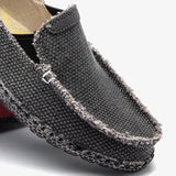 Black woven loafers, breathable and lightweight slip-on shoes with a textured pattern.