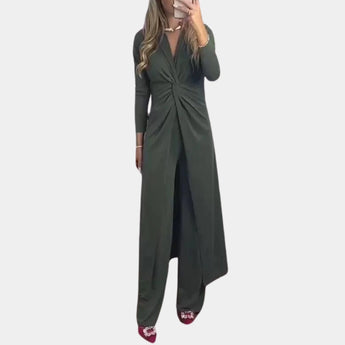Green wrap V-neck midi dress with asymmetrical design featuring long sleeves and a fitted waist, worn by a model.