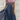 Blue and black floral sequin V-neck knee-length cocktail dress with blue rose pattern, displayed on a mannequin, highlighting the dress's elegant design and shimmering sequin detailing.