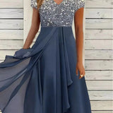 Blue and black floral sequin V-neck knee-length cocktail dress in a blue silver colorway, displayed on a mannequin showcasing the dress's intricate design and elegant style suitable for formal occasions.