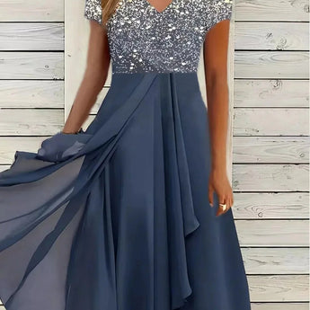 Blue and black floral sequin V-neck knee-length cocktail dress in a blue silver colorway, displayed on a mannequin showcasing the dress's intricate design and elegant style suitable for formal occasions.