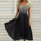 Blue and black floral sequin V-neck knee-length cocktail dress in black gold color shown on a model, emphasizing the elegant design and intricate detailing.