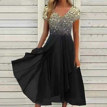 Blue and black floral sequin V-neck knee-length cocktail dress in black gold color shown on a model, emphasizing the elegant design and intricate detailing.