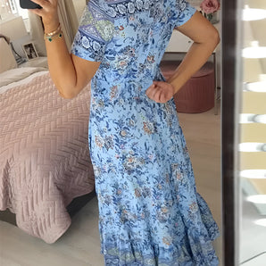 Blue Bohemian floral maxi dress featuring lace details and a ruffled hem, showcasing a flowing one-piece garment with a focus on the neck, shoulder, and sleeve design.