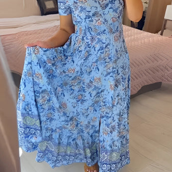 Blue Bohemian Floral Maxi Dress with lace detailing and a ruffled hem, featuring a flowing design with short sleeves and a fitted waist, available in size 3XL.