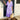 Purple and blue bohemian midi dress with a floral pattern, featuring sleeves and pockets; modeled by a smiling woman, showcasing a relaxed fit around the waist; the dress is suitable for summer occasions.