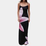 A blue floral maxi dress with spaghetti straps, designed as beachwear for summer.
