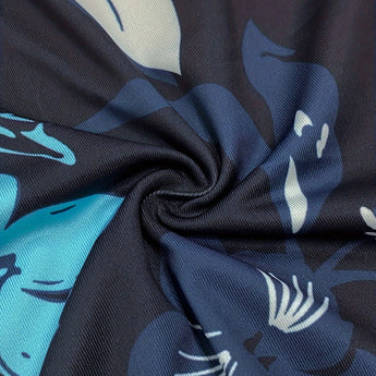 A casual short sleeve summer tunic dress featuring a blue floral print design.