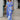 Blue floral V-neck maxi dress in size XL, featuring long sleeves, a cinched waist, and elegant resort wear design. The dress is styled with vibrant blue hues and floral patterns, perfect for summer outings and vacations.