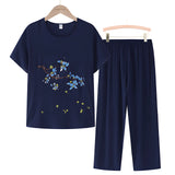 Women's dark blue linen top and floral embroidery blouse with short sleeves, shown in size 4XL.