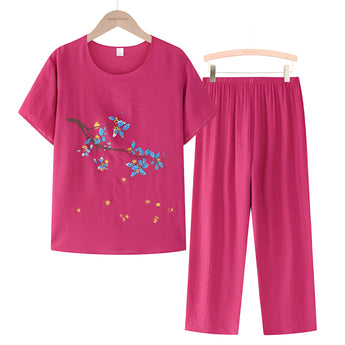 Women's dark pink floral embroidery blouse and pants set, featuring a sleeveless top with a V-neck collar and casual summer design.