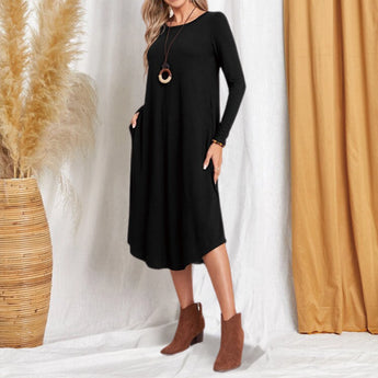 
A black knee-length one-piece dress with long sleeves designed for women's casual wear, available in an XL size. The dress features a comfortable fit, with attention to shoulder and waist detailing, suitable for fashion-conscious individuals.