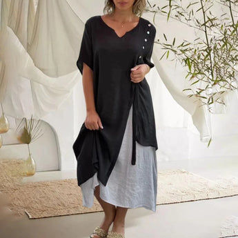
A black asymmetric tunic dress featuring a draped neckline and short sleeves, designed for women in a 3XL size, showcasing an elegant knee-length fit suitable for summer wear.
