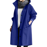 Woman wearing an oversized blue waterproof hooded raincoat with sleeves and a collar, available in size 4XL.
