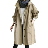 A stylish, lightweight, and breathable khaki oversized women's waterproof hooded raincoat in 4XL with long sleeves and a collar, resembling a trench coat design.