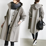 Blue oversized women's waterproof hooded raincoat, stylish and lightweight with long sleeves and a breathable design.