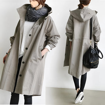 Blue oversized women's waterproof hooded raincoat, stylish and lightweight with long sleeves and a breathable design.