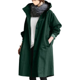 Dark green oversized women's waterproof hooded raincoat in 4XL, stylish and lightweight with breathable fabric, featuring long sleeves, a wrap design, and a comfortable collar.
