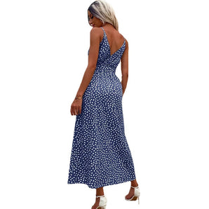 Blue polka dot sleeveless maxi dress with a V-back design, suitable for summer evening wear, showcasing a flattering waist and elegant neckline.