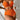 Orange bikini top with a ribbed texture and a twisted front design, modeled on a person showcasing the piece's adjustable fit and flattering silhouette.