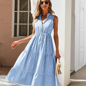 Blue striped sleeveless midi dress with a V-neck and button-front design, suitable for casual daytime wear.