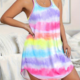 A woman wearing a blue and white geometric patterned V-neck sleeveless A-line summer dress.