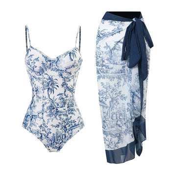 Blue and white porcelain one-piece swimsuit featuring a tropical palm design, displayed flat with a high neckline and sleeveless style, suitable for size XL.