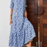 Fashion model wearing a blue and white V-neck boho maxi dress with short sleeves, showcasing the lightweight summer beachwear.