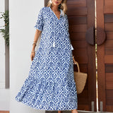 Blue and white V-neck boho maxi dress, lightweight summer beachwear, featuring short sleeves and cinched waist.