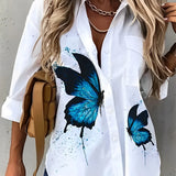
A blue and white women's floral blouse designed as a lightweight summer top in size 5XL, featuring a vibrant floral pattern with hints of azure, green, and black.