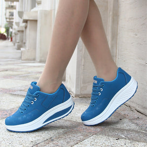 Blue women's platform sneakers featuring a stylish and breathable design, with a focus on comfort.