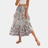 
A Bohemian Blue Floral Maxi Skirt in lightweight fabric, suitable for summer beachwear, displayed in a Beige color and XL size, with a focus on its flowing design.