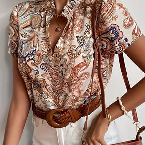 Bohemian Chic Paisley Silk Blouse featuring a vintage-inspired design with a high collar, long sleeves, and intricate paisley pattern in a soft, flowing silk fabric.